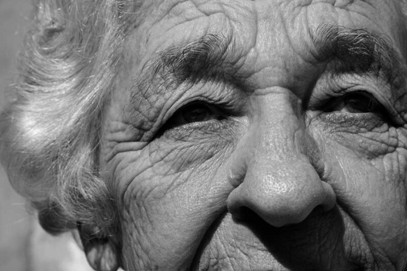 a wrinkled face of an old woman